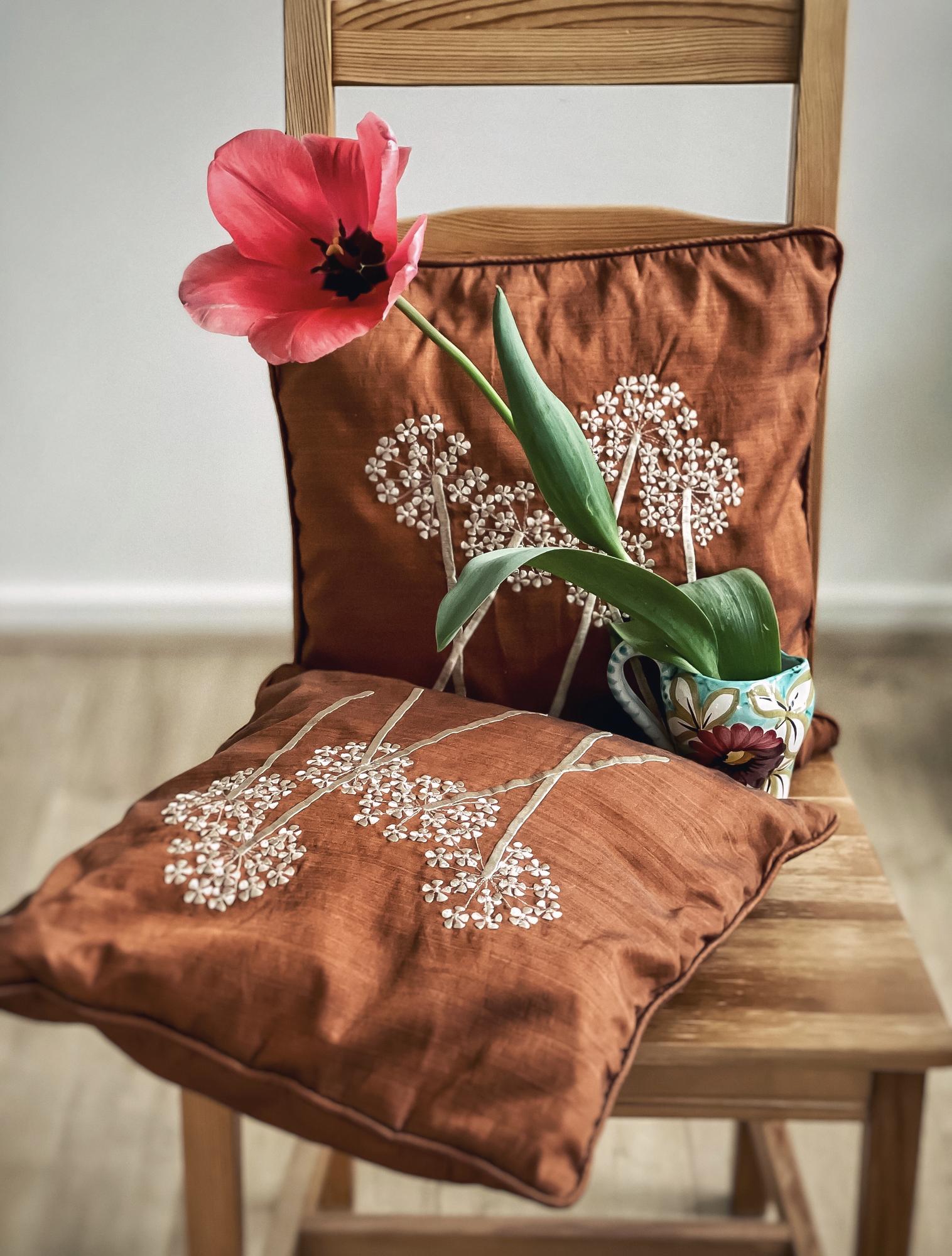 Large editorial shot of embroidered textile on table